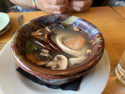 Lemongrass soup with seafood: scallop, shrimp, calimari, and mussels.