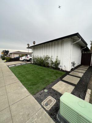 Concrete walk way on the side of the house.  Finally, a path to pull my trash bins in and out with ease!