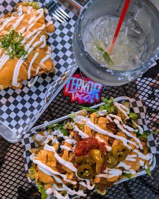 Quesadilla (left) Margarita with salt, and Loaded nachos with carnage asada