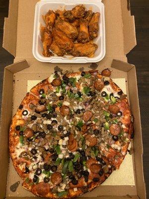 Large combo pizza and a dozen of hot wings