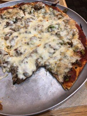 Crust and food on House Special Pizza.