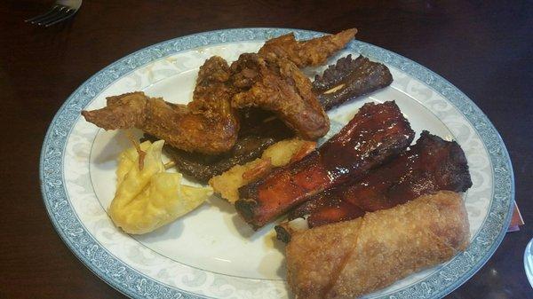 Appetizer platter (missing a shrimp, a wonton and a teriyaki beef skewer, we were hungry lol).