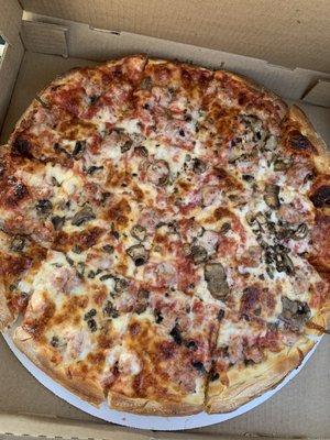 Large mushroom and sausage pizza