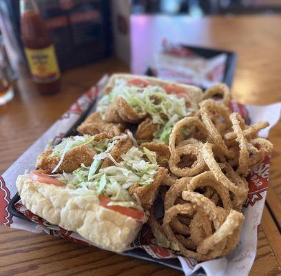 Fish poboy with onion rings.