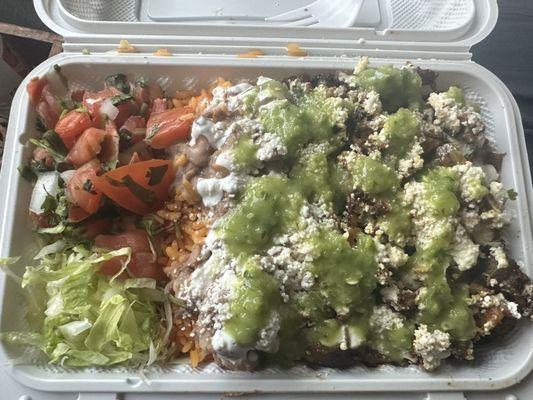 Carne enchilada plate with extra cheese and their home made hot sauce