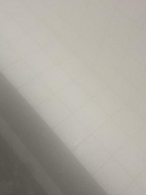 You can't see it but the grout in between the tiles is stained with dirt from peoples shoes