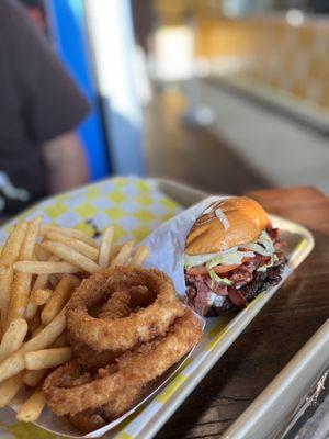 All American Double Burger with pastrami, Fries & Onion Rings on the side