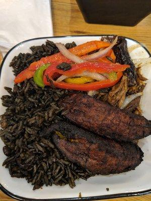 Pernil (pork) lunch bowl with black rice and sweet plantains.