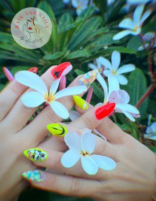 Neon Polygel nails with fun nail designs custom created at cave Creek nail salon.