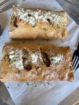 This is ONE stromboli-cut in half. That's right, ONE.