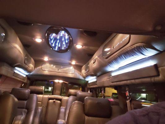 The interior of my conversion van prior to the seats coming out for camping. It's a pretty limo for big families.