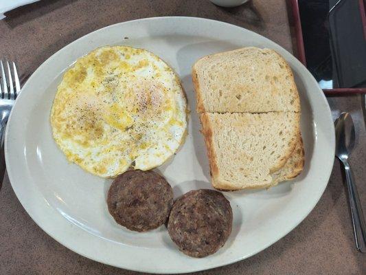 Eggs, sausage, and sourdough toast.