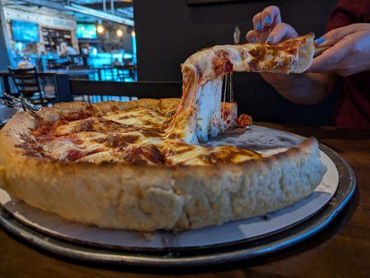 Buttercrust Cheese Pizza complete with epic cheese pull