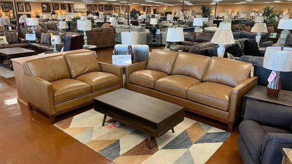 Check out this REAL LEATHER sofa and loveseat that sits like a cloud! Come try it out!