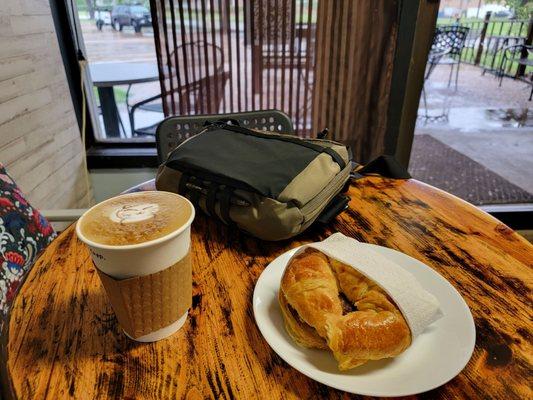 A Quick Cappuccino and Sausage Egg Croissant sandwich.