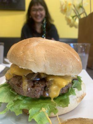 Cheeseburger and happy girlfriend