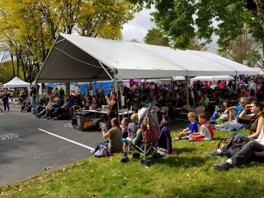 Tent with tables and view of stage