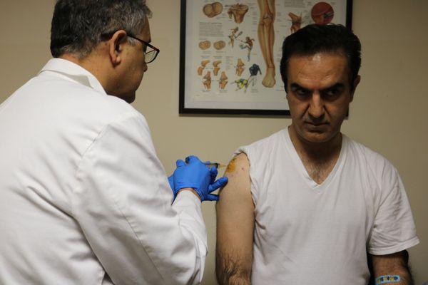 Patient receiving a PRP injection to the shoulder.