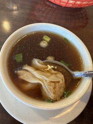 Wonton soup (with soy sauce I added )