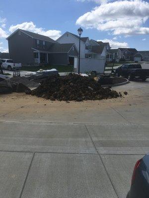 Dirt Piled behind my driveway making it impossible to exit my drive.