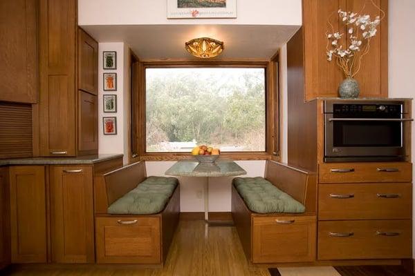 Cantilevered dining area extends out from house. Custom benches with lots of storage.