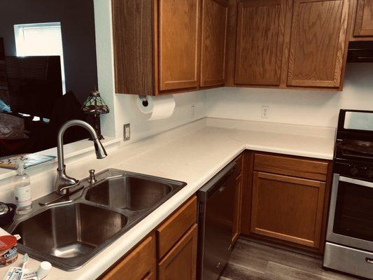 Old kitchen countertop and cabinets.