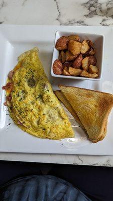 Southern omelette with home fries and toast