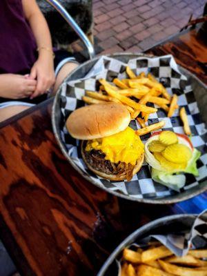 Mushroom Swiss burger with cameralized onions and freshly seasons fries.