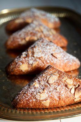 Almond croissants, baked daily in our bakery.