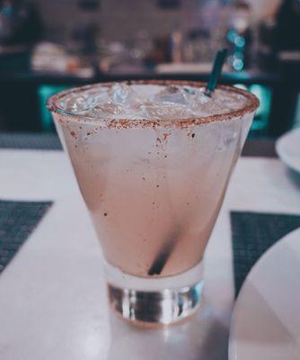 Jalapeño margarita on the rocks with cactus salt rim.