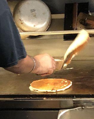 Flipping the Flap Jacks on Uptown's grill.