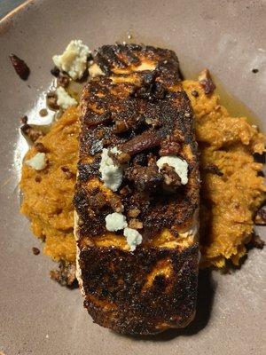 Salmon atop mashed sweet potatoes