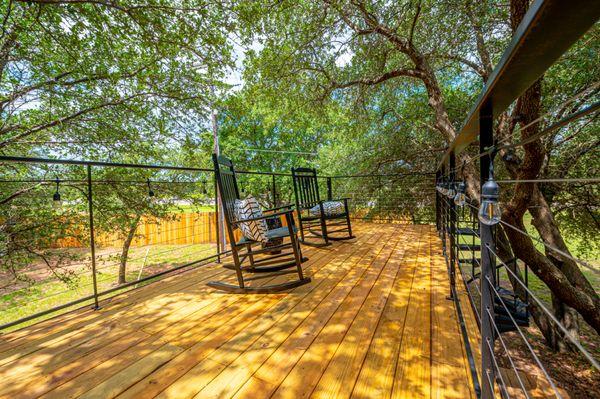 Enjoy an afternoon on one of our upstairs patios on our tiny home vacation rentals in Waco, Texas!