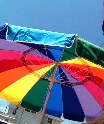 There are a couple of tables outside, and the umbrella is nice on sunny days!