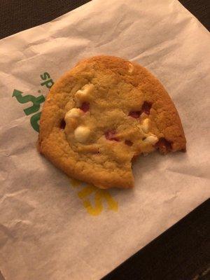 A cookie with a bite taken out of it from an employee.