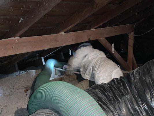 Attic blown insulation removal.