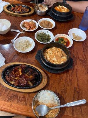 Spicy pork, oyster soon-tofu soup w/fish roe extra spicy . Other side spicy chicken w/beef soon-tofu soup medium spice & various banchans.