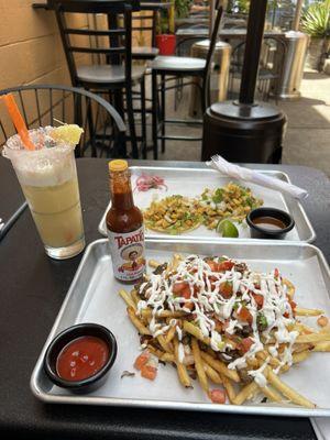 Asada fries and chicken tacos and a Pina colada