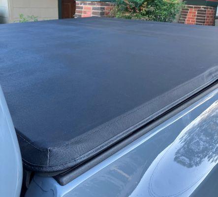 TonnoPro Tri-Fold Tonneau Cover installed on 2024 Nissan Frontier Pro X