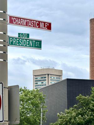 The World Trade Center in the background of the famed "Charm'tastic Mile" Street Sign entering Harbor East.