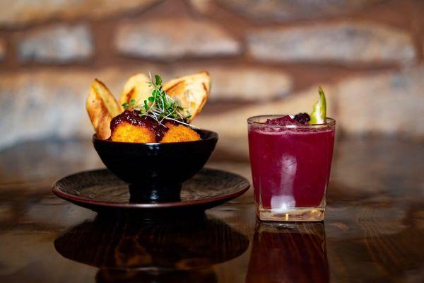 "Savory and Sweid" goat cheese balls paired with a signature cocktail.