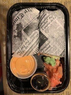 sushi burrito in a takeout container