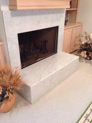 Marble fireplace built by Planett Granite 6 years ago. Still looking great!