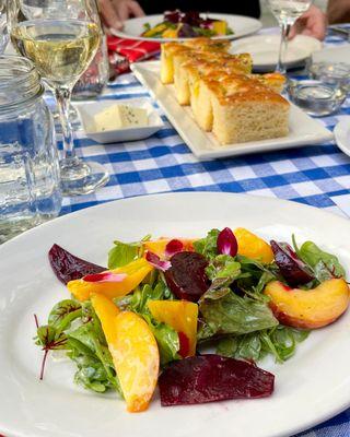 Colorado Beet & Peach Salad served over Baby Greens and Whipped Goat Cheese