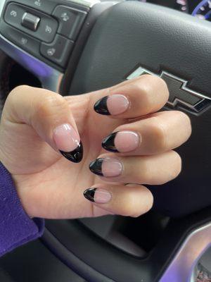 Acrylic almond shaped nails with black tips