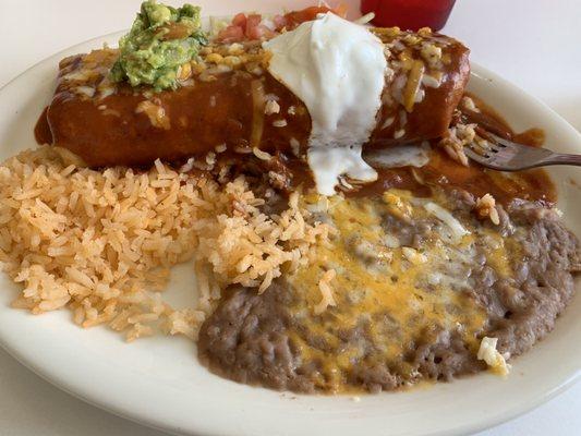 Smothered chimichanga with carne asada and red sauce