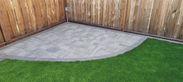 Diamond shaped corner paver with border and electric outlet.