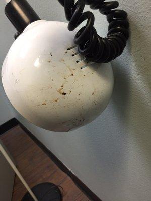 Old blood on a lamp in the exam room