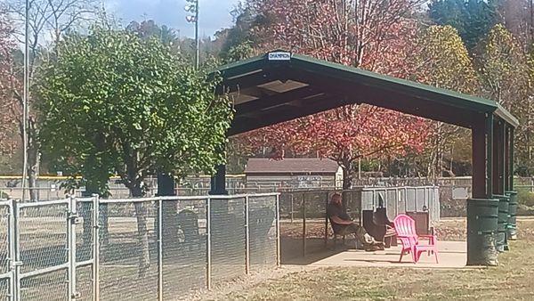 Central shade structure with half being in the big and half being in the small dog park with a nice concrete foundation