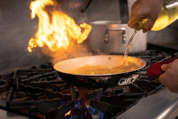 Our chef making a chicken dish from our rotating specials list for din-in on the weekends